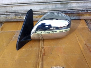 (2003-2009) TOYOTA LAND CRUSER LEFT SIDE MIRROR FOR SALE .IN GOOD CONDITIN