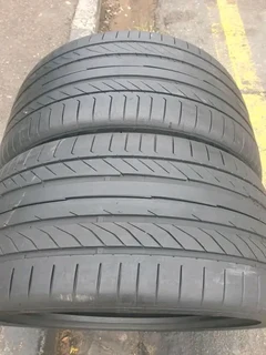 2x 295 35 21 Continental tyres with good treads available for sale