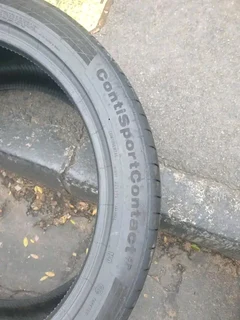 2x 295 35 21 Continental tyres with good treads available for sale