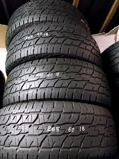 A clean set of 265 60 18 tyres with 8t% treads available for sale