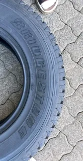 A clean set of 265 65 17 Bridgestone dueler tyres with good treads available for sale