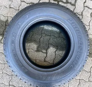 A clean set of 265 65 17 Bridgestone dueler tyres with good treads available for sale