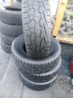 A clean set of 265 70 16 AT tyres with good treads available for sale