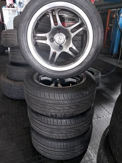 A clean set of 15inch rims and tyres pcd 4/100 available for sale