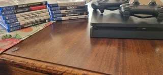 Play Station 4 with 2 controllers and 11 games