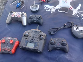 RC DRONES, HELICOPTERS AND CONTROLLS (NOT WORKING)