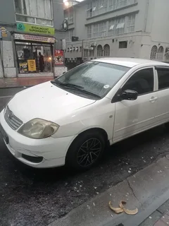 White Toyota Corolla kokoroshe start and go