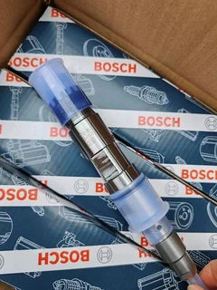 Man Brand New Bosch Fuel Injectors