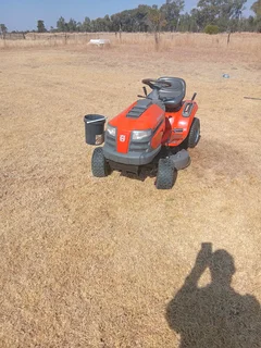 Hasqurvana lawn tractor and brick machine