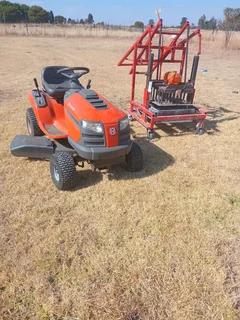 Hasqurvana lawn tractor and brick machine