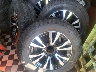 .18 inch Isuzu mags with 255/60R18 General Grabber tires.