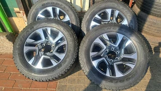 18 inch Toyota mags with 265/60R18 continental tires, leave me your whatsapp number if interested.