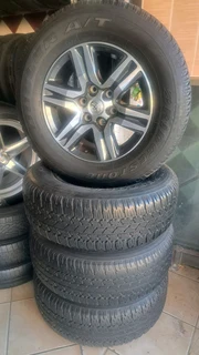 265/65R17 Toyota Mags and Bridgestone tires, leave your whatsapp number if interested.