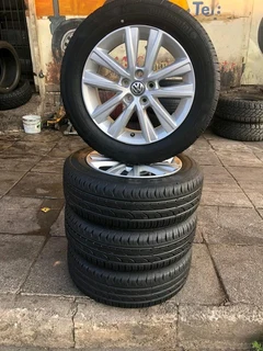 15 inch polo mags with 185/60R15 continental tires of 98%. leave your whatsapp number if interested.