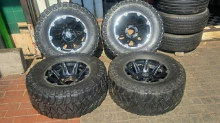 305/65R17 Mickey thompson tires and rims.