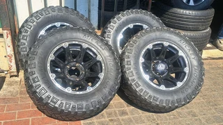 305/65R17 Mickey thompson tires and rims.