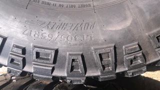 305/65R17 Mickey thompson tires and rims.