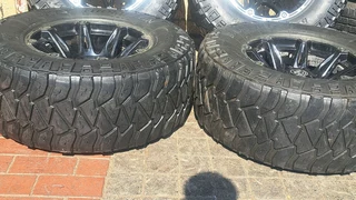 305/65R17 Mickey thompson tires and rims.