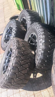 305/65R17 Mickey thompson tires and rims.