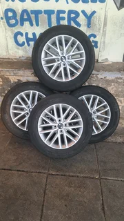 15 inch Kia mag rims with 185/65R15 tires for sale. leave your whatsapp number if interested.