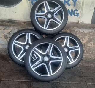 Original 19 inch AMG Mercedes mags and 235/45R19 Bridgestone tires. leave your whatsapp number.