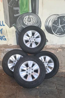 Toyota Hilux rims with 265/65R17 tires. leave your whatsapp number if interested for follow-up.