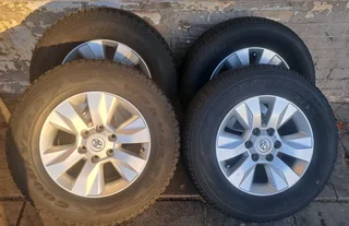 Toyota Hilux rims with 265/65R17 tires. leave your whatsapp number if interested for follow-up.