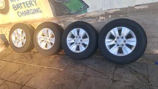 Toyota Hilux rims with 265/65R17 tires. leave your whatsapp number if interested for follow-up.