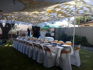 Stretch tent hire with tables and chairs. Marquee tent with all sides and windows. Full decor set up