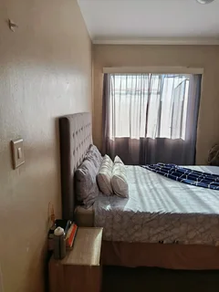 A   semi furnished  room to rent in a 3 bedroom apartment in milnerton center point