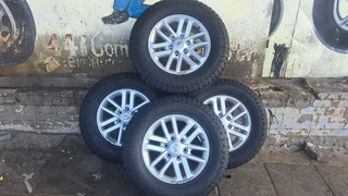 Toyota silver mag &amp; 265/65R17 General grabber . Leave your whatsapp number if interested.