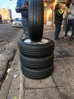 15 inch polo mags &amp; tires of 95% thread left. leave your whatsapp number if interested.