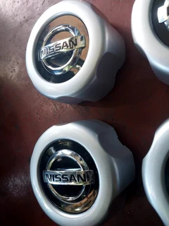 Nissan hardbody center caps available. leave your whatsapp number if interested.