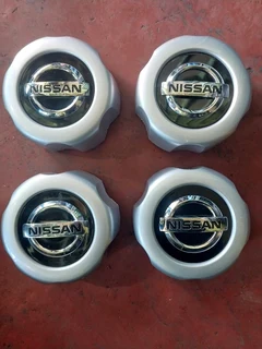 Nissan hardbody center caps available. leave your whatsapp number if interested.