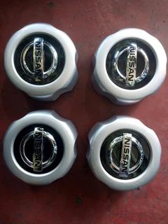 Nissan hardbody center caps available. leave your whatsapp number if interested.