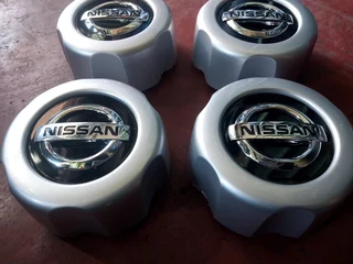 Nissan hardbody center caps available. leave your whatsapp number if interested.