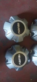 Black &amp; silver Isuzu d-max center caps available. leave your whatsapp number if interested.