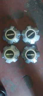 Black &amp; silver Isuzu d-max center caps available. leave your whatsapp number if interested.