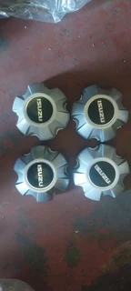 Black &amp; silver Isuzu d-max center caps available. leave your whatsapp number if interested.