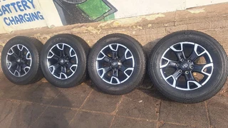 Toyota lengend 50 mags and 265/60R18 Dunlop tires. Leave your whatsapp number if interested.
