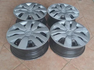  14-inch Toyota steel rims (4X100 pcd) and Wheel covers. Leave your whatsapp number if interested