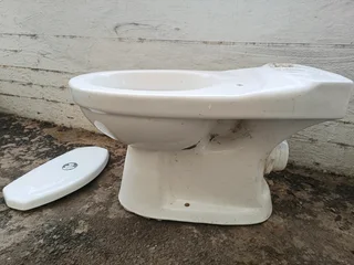 Porcelain Toilet bowl,cistern lid, toilet fittings, & pipe
