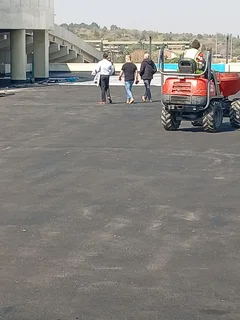 Tar surfacing road markings slurry seal brick paving