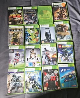 Xbox 360,2 controllers with one charger, and 16 games