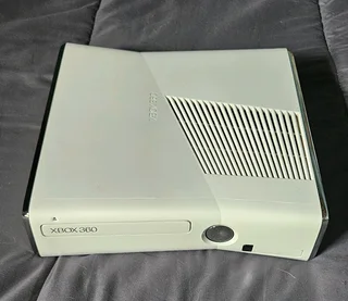Xbox 360,2 controllers with one charger, and 16 games