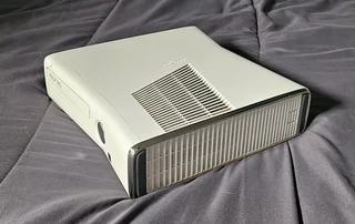 Xbox 360,2 controllers with one charger, and 16 games