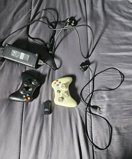 Xbox 360,2 controllers with one charger, and 16 games