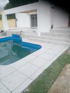 LAMINATE FLOORING AND TILING WALLS