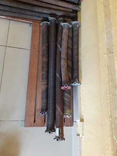 Sectional garage door springs