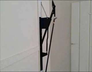 Garage door tip-up hinges